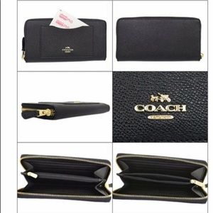 ***SOLD***Excellent condition! Black Coach zip around wallet.